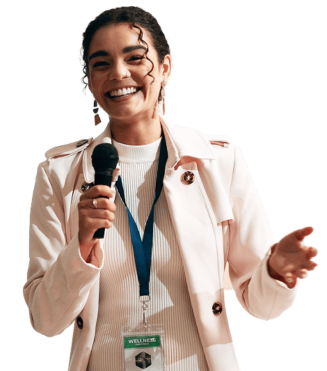 Smiling speaker holding a microphone