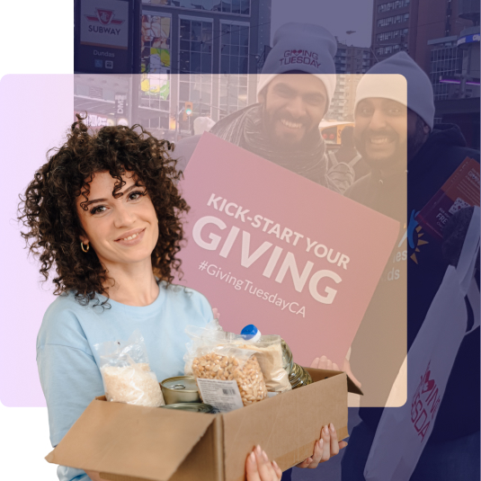 A GivingTuesday supporter holding a donation box