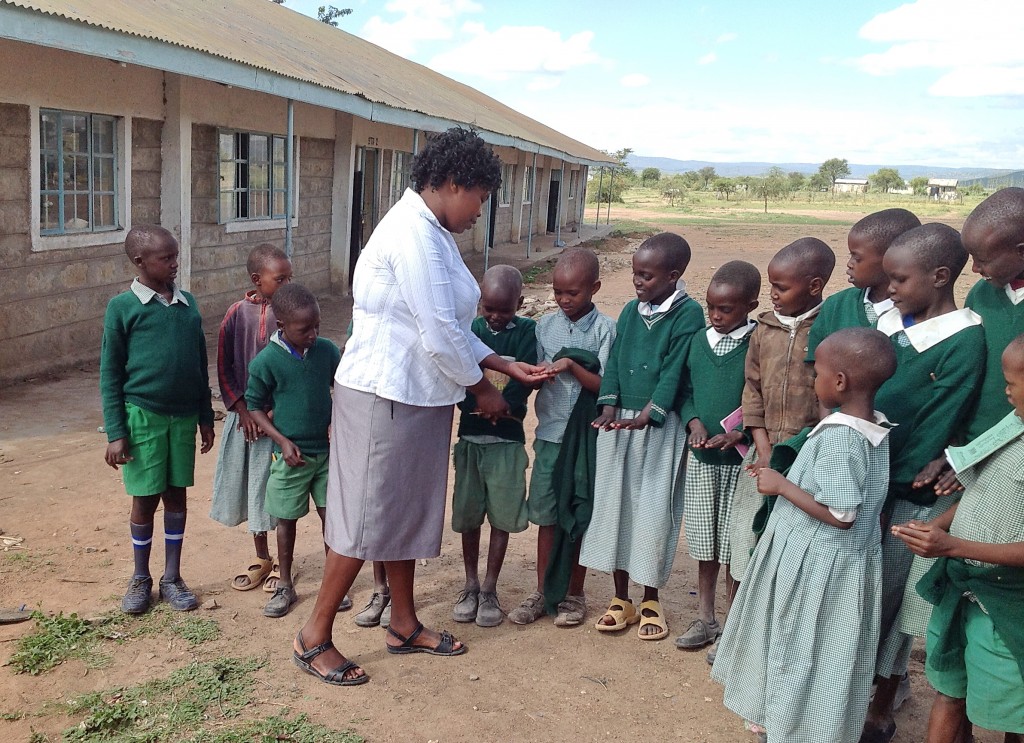 Each morning, Sarah inspects her students’ faces, hands and fingernails to ensure they are clean