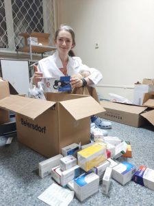 doctor opening a box of medicine in Ukraine