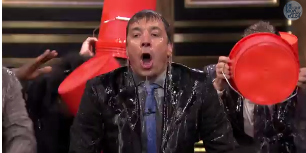 Jimmy Fallon reacting to cold ice being poured on his head