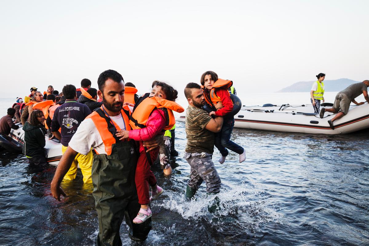 Greece. Refugees arrive on the shores of the island of Lesbos after crossing the Aegean sea from Turkey